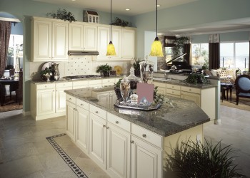 Features white painted maple with grey-glaze to blend with the customer's existing granite countertops.
