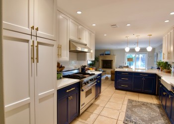 View One of Two-Tone Refacing in Royal Blue and White Thermafoil with Gold Hardware.