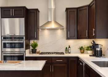 Solid Maple Refacing & Quartz Countertops Ivory Taj Quartz countertops & LaPrada-stained solid maple cabinet refacing..