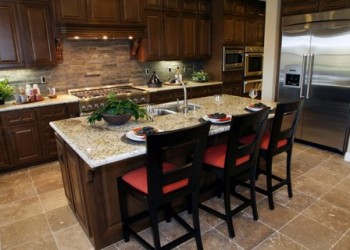 Tuscany Espresso stained maple with quartz countertops.